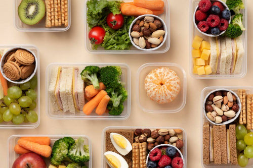 Prepared meals arranged in plastic containers for efficient food service, storage, and delivery operations