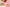 Plastic food containers holding prepared meals, vegetables, and bread for catering service